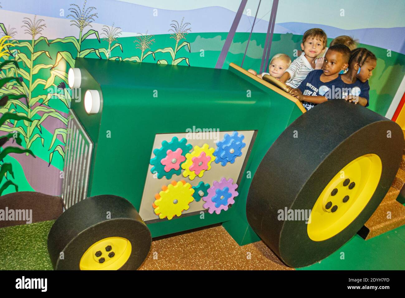 Tuscaloosa Alabama,Children's Hands On Museum,Black student students driving tractor boy girl kids children, Stock Photo