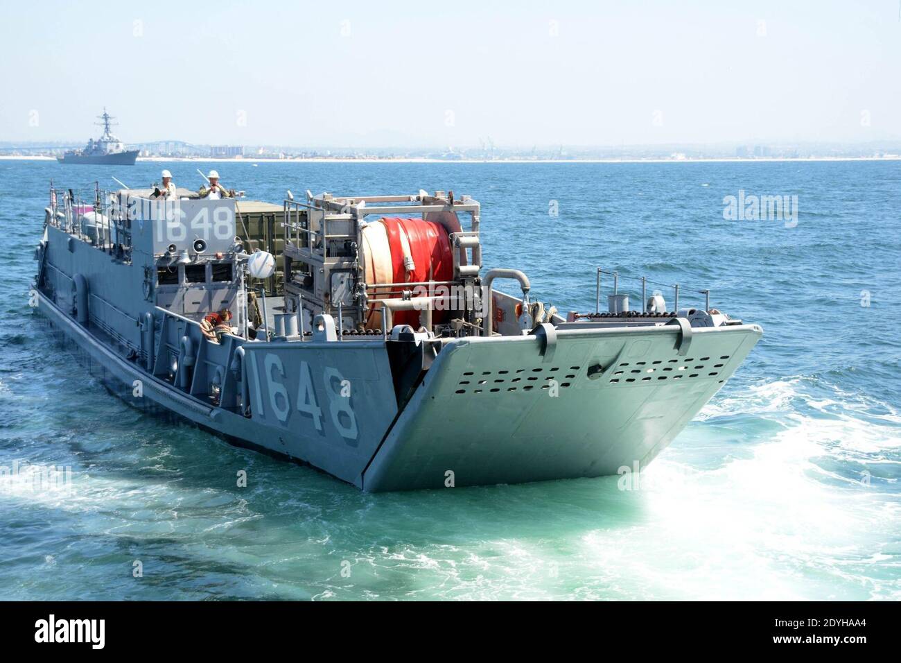 LCU 1648 prepares to enter the well deck of the dock landing ship USS Comstock (LSD-45) - 1. Stock Photo