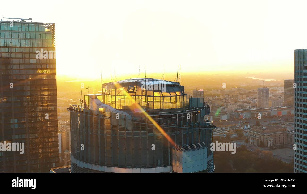 Warsaw, Poland 01.11.2020 Golden sunrise over the Warsaw office tower Spektrum tower and club The View. Aerial. High quality photo Stock Photo