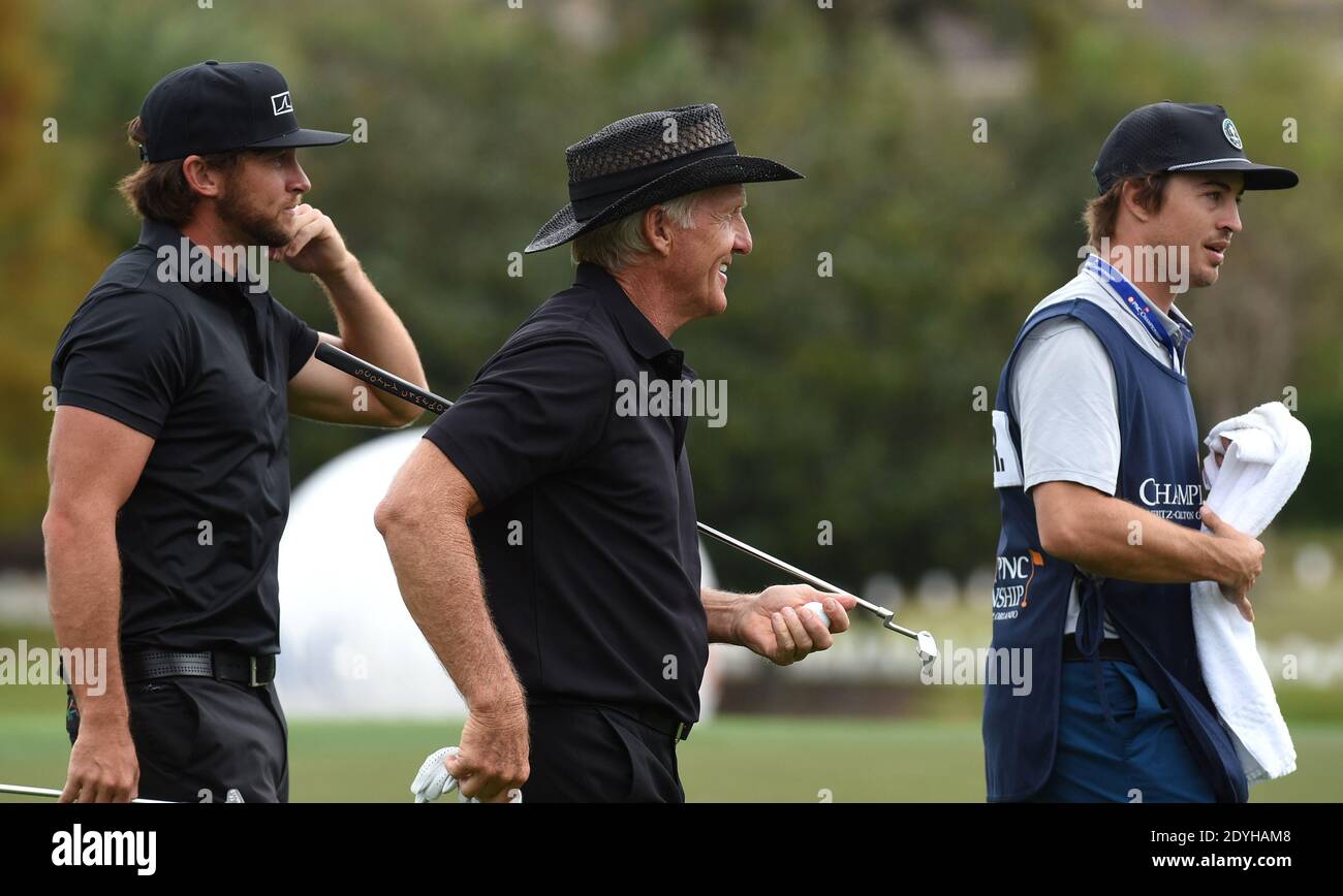 December 20, 2020 - Orlando, Florida, United States - Australian Greg Norman and his son, Greg Norman Jr. prepare to putt on the 18th green during the final round at the PNC Championship golf tournament at the Ritz-Carlton Golf Club on December 20, 2020 in Orlando, Florida. On Christmas Day, Norman posted a photo to Instagram from a hospital bed where he was being treated for COVID-19 symptoms. NormanÕs son also posted a photo to Instagram, stating that he and his fiancee have tested positive for the COVID-19 virus. (Paul Hennessy/Alamy) Stock Photo