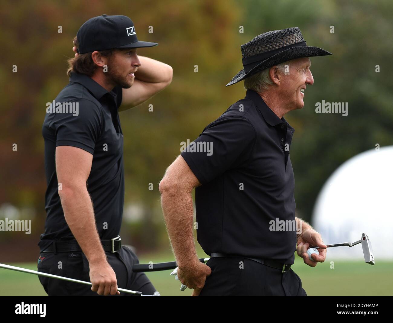 December 20, 2020 - Orlando, Florida, United States - Australian Greg Norman (r) and his son, Greg Norman Jr. prepare to putt on the 18th green during the final round at the PNC Championship golf tournament at the Ritz-Carlton Golf Club on December 20, 2020 in Orlando, Florida. On Christmas Day, Norman posted a photo to Instagram from a hospital bed where he was being treated for COVID-19 symptoms. NormanÕs son also posted a photo to Instagram, stating that he and his fiancee have tested positive for the COVID-19 virus. (Paul Hennessy/Alamy) Stock Photo