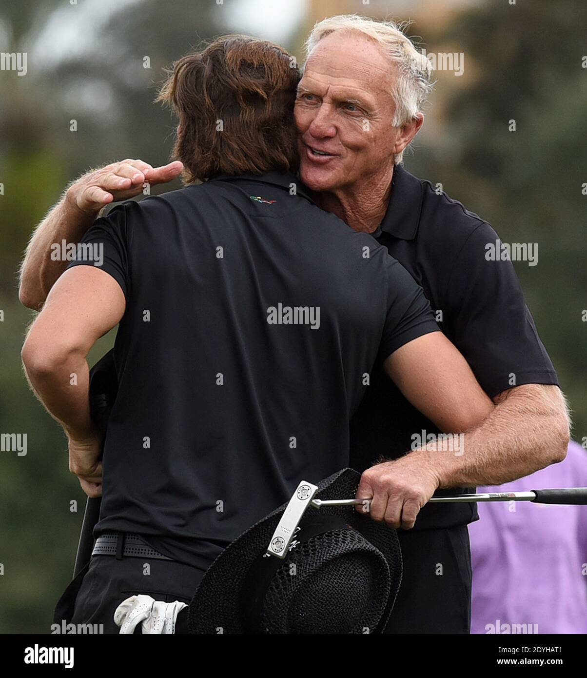 December 20, 2020 - Orlando, Florida, United States - Australian Greg Norman (r) and his son, Greg Norman Jr. embrace after completing the final round at the PNC Championship golf tournament at the Ritz-Carlton Golf Club on December 20, 2020 in Orlando, Florida. On Christmas Day, Norman posted a photo to Instagram from a hospital bed where he was being treated for COVID-19 symptoms. NormanÕs son also posted a photo to Instagram, stating that he and his fiancee have tested positive for the COVID-19 virus. (Paul Hennessy/Alamy) Stock Photo