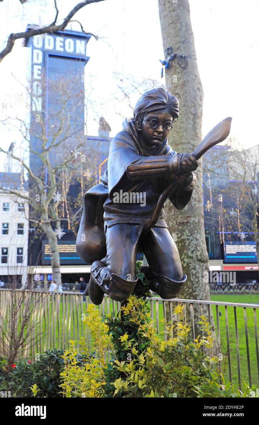 The latest film character themed statue in Leicester Square - Harry Potter, showing a scene from The Philosopher's Stone, showing the young wizard playing Quidditch, in London, UK Stock Photo