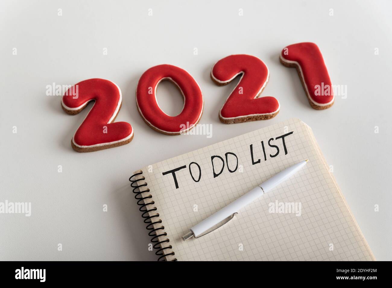 Notepad with inscription TO DO LIST pen and numbers 2021 on white ...