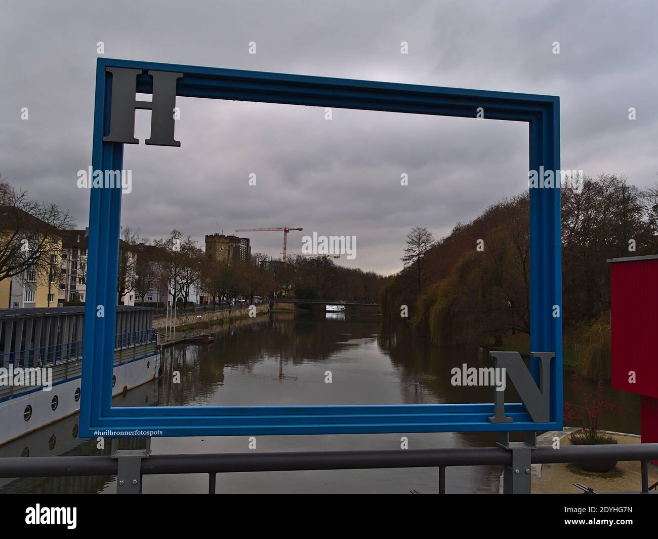 Blue picture frame set up by city administration for marketing reasons to highlight attractive photo spots for tourists with Neckar river and tower. Stock Photo