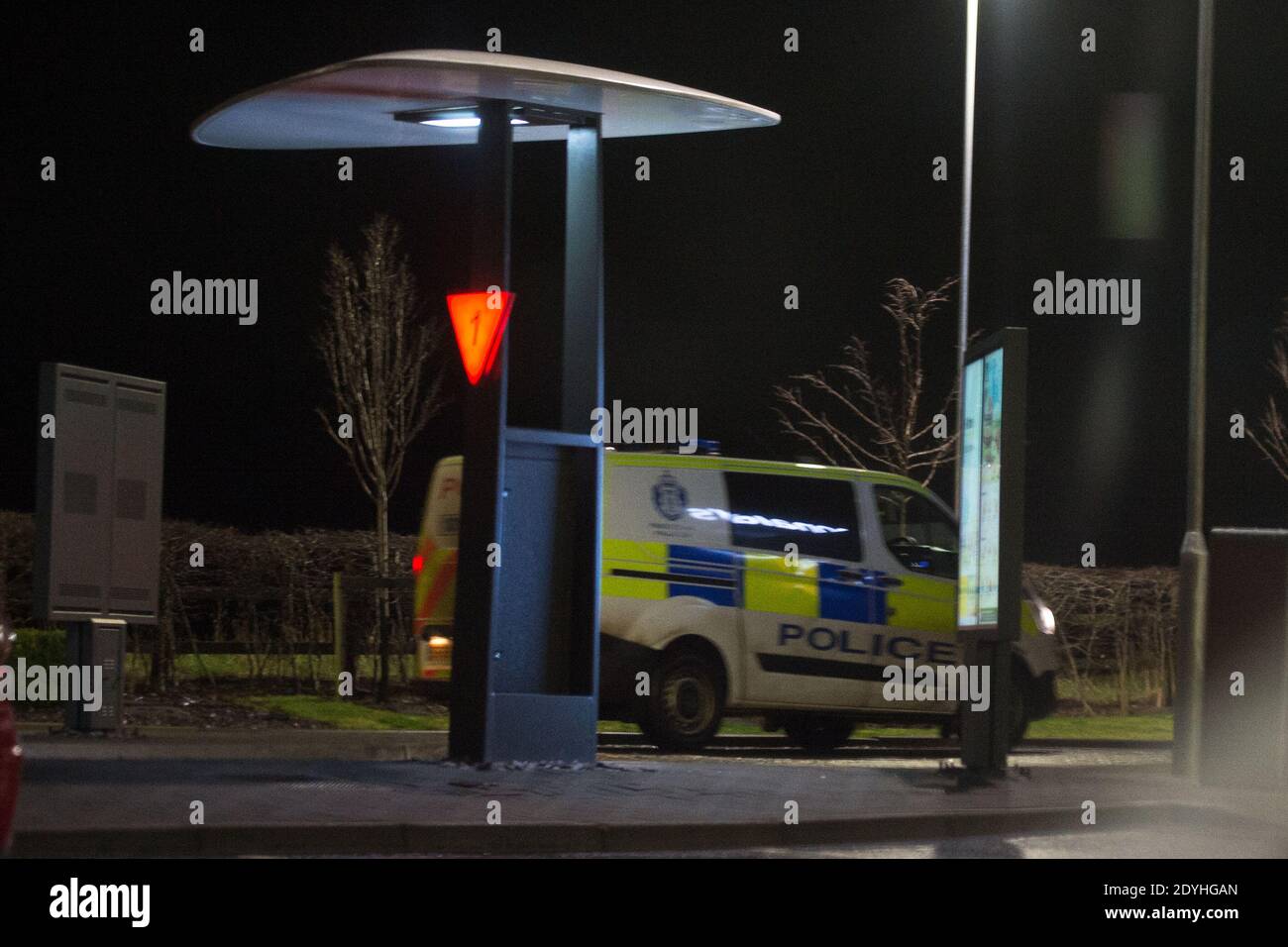 Dunbar, Scotland, UK. 26th Dec, 2020. Pictured: After being on the road for 5 hours plus including being at the Scottish/English border for 2 hours this is the first police car/van that I have seen, at McDonalds Drive Thru, after driving back up to Dunbar from the border. Credit: Colin Fisher/Alamy Live News Stock Photo