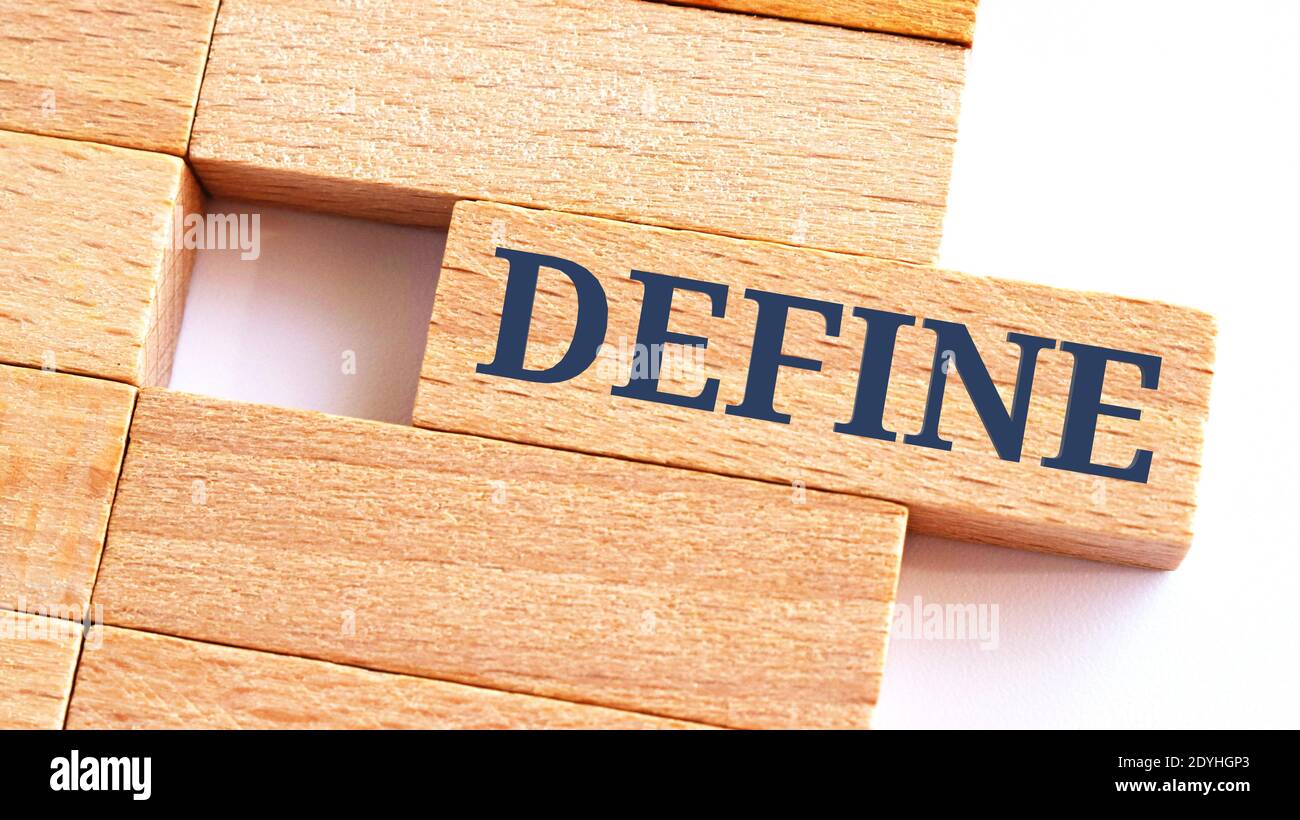 DEFINE word written on wood block. step text on table, concept Stock Photo