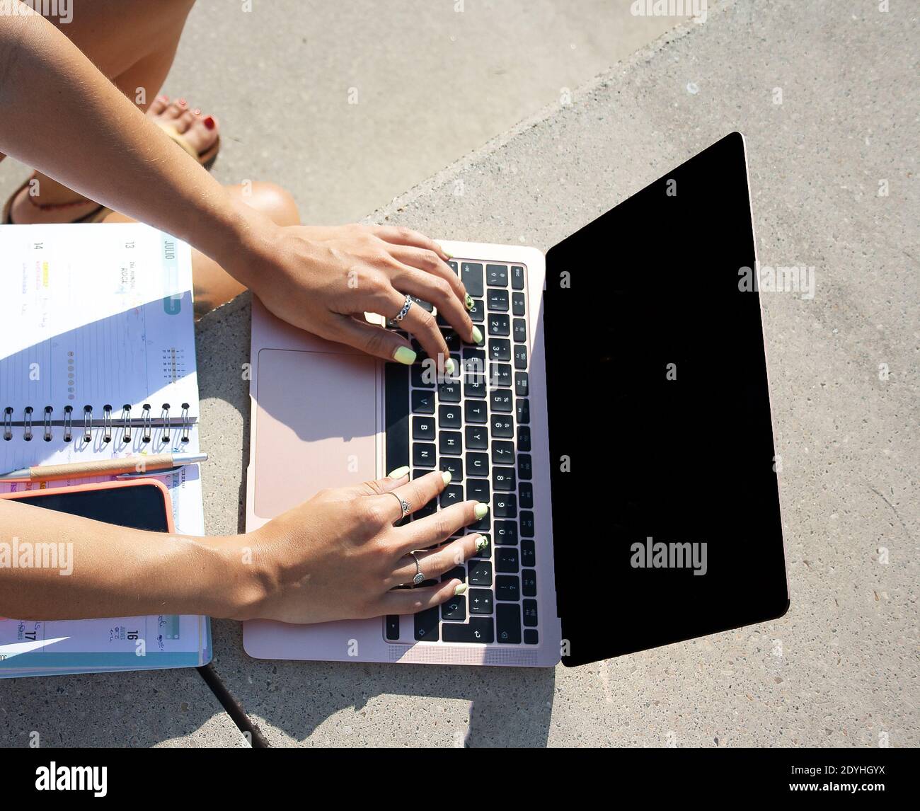 Woman hands typing on laptop Stock Photo