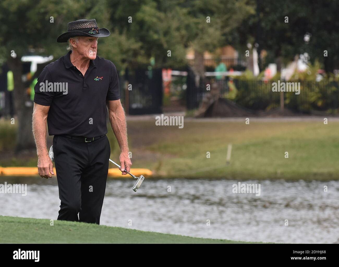 Australian Greg Norman approaches the 18th green during the final round at the PNC Championship golf tournament at the Ritz-Carlton Golf Club. On Christmas Day, Norman posted a photo on Instagram from a hospital bed where he was being treated for COVID-19 symptoms. Norman's son also posted a photo on Instagram, stating that he and his fiancée have tested positive for the COVID-19 virus. Stock Photo