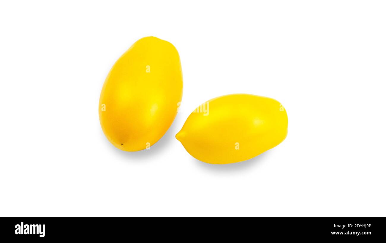 Yellow tomato elongated shape on a white background. Tomato variety Golden lemon or Akmore Treasure. High quality photo Stock Photo