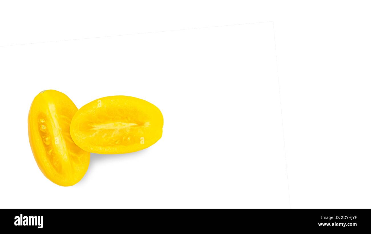Yellow tomato elongated shape on a white background. Tomato variety Golden lemon or Akmore Treasure. High quality photo Stock Photo