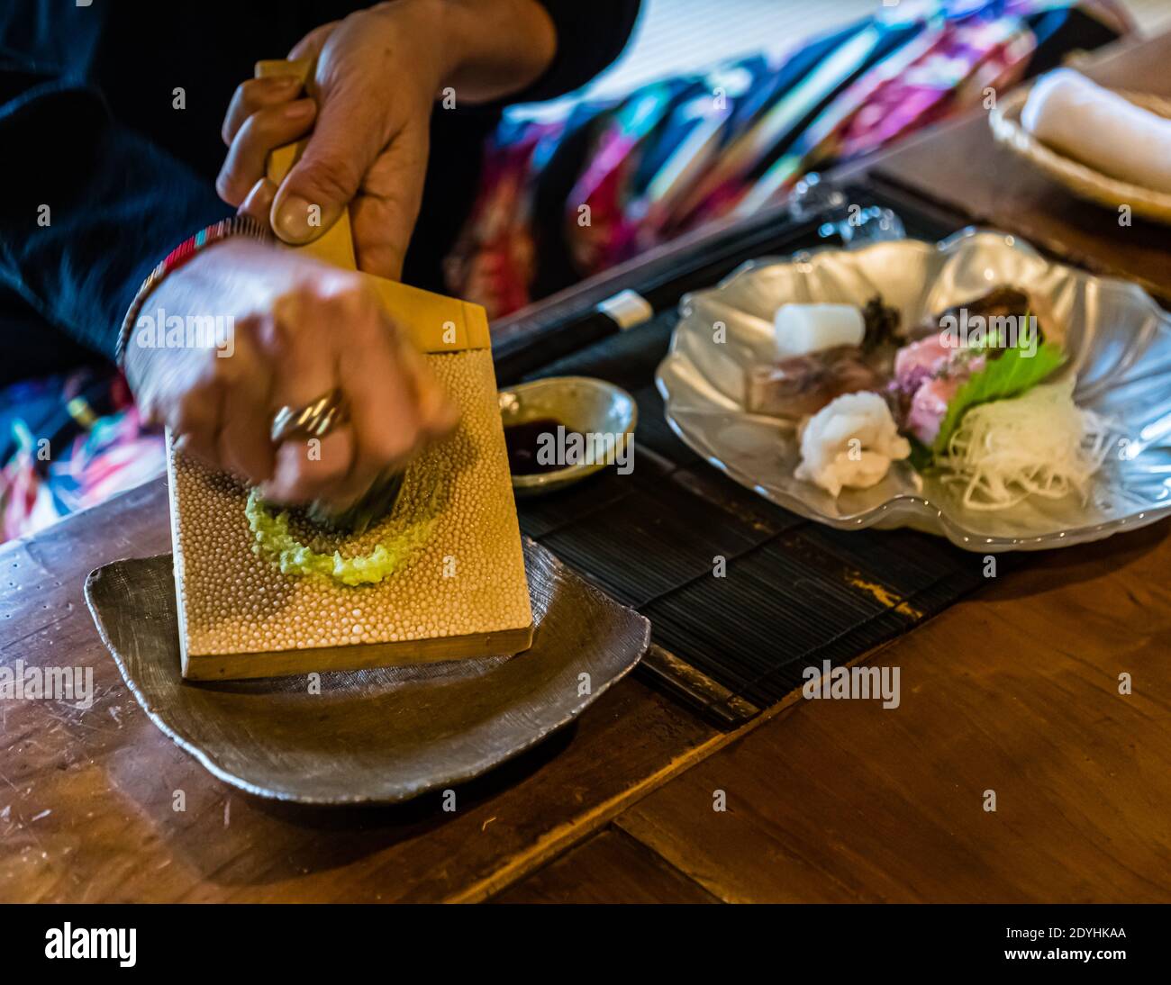 Restaurant Rakan by Atsuko Kato: Freshly grated wasabi is an indispensable part of kaiseki cuisine and represents the ideals of freshness, seasonality, harmony and aesthetic perfection. The preparation and use of freshly grated wasabi are part of the high level of craftsmanship and hospitality that characterise kaiseki. Stock Photo