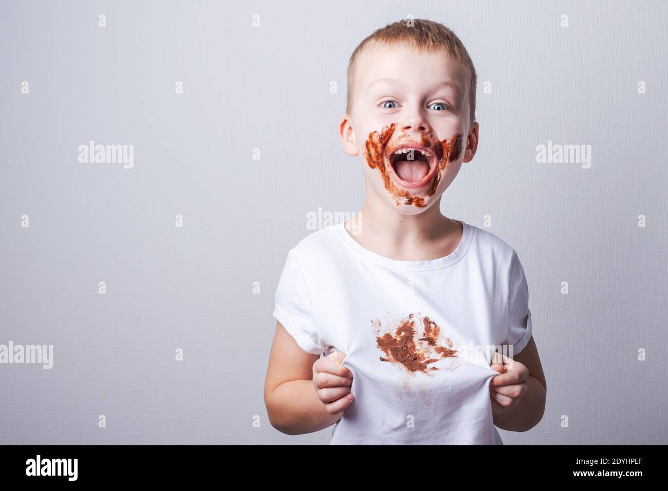 chocolate stain on white baby clothes. High quality photo Stock Photo