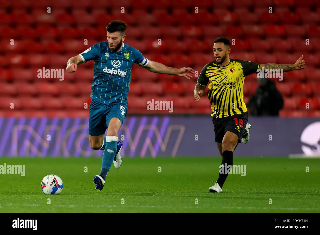 Vicarage Road, Watford, Hertfordshire, UK. 26th Dec, 2020. English Football League Championship Football, Watford versus Norwich City; Grant Hanley of Norwich City under pressure from Andre Gray of Watford Credit: Action Plus Sports/Alamy Live News Stock Photo