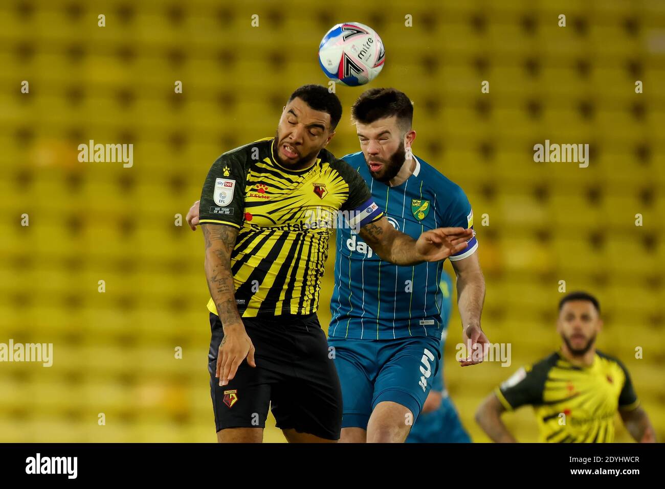 Vicarage Road, Watford, Hertfordshire, UK. 26th Dec, 2020. English Football League Championship Football, Watford versus Norwich City; Grant Hanley of Norwich City wins a header against Troy Deeney of Watford Credit: Action Plus Sports/Alamy Live News Stock Photo