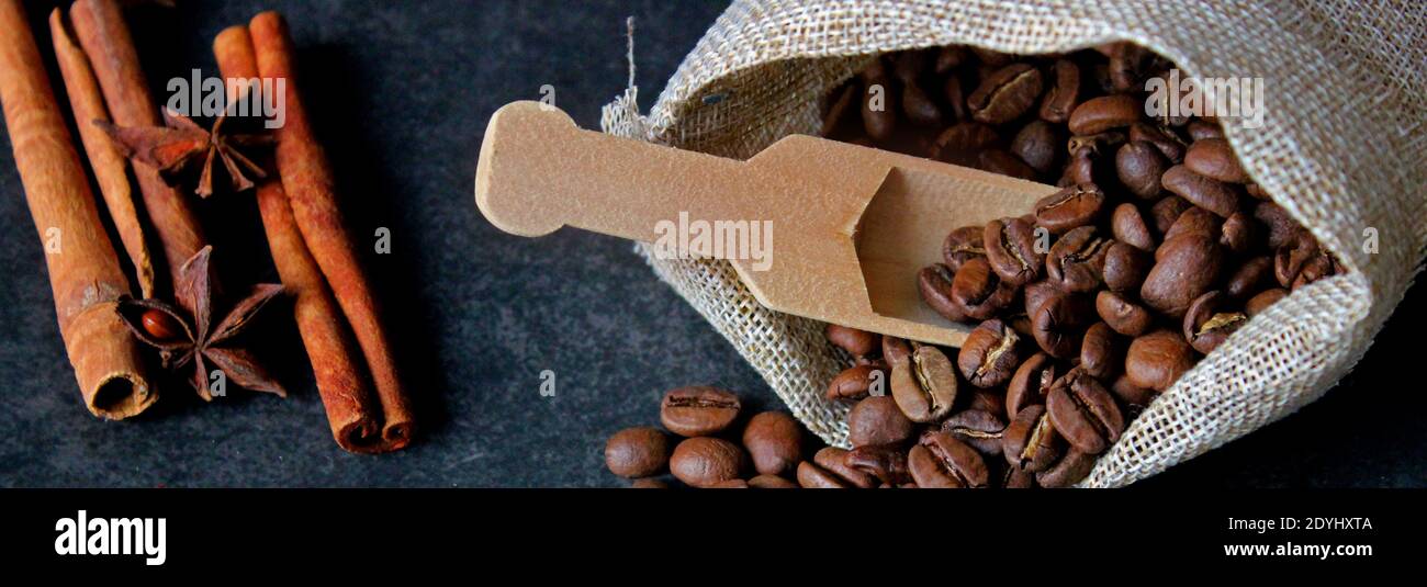 Cup of coffee, bag and scoop on old rusty background Stock Photo