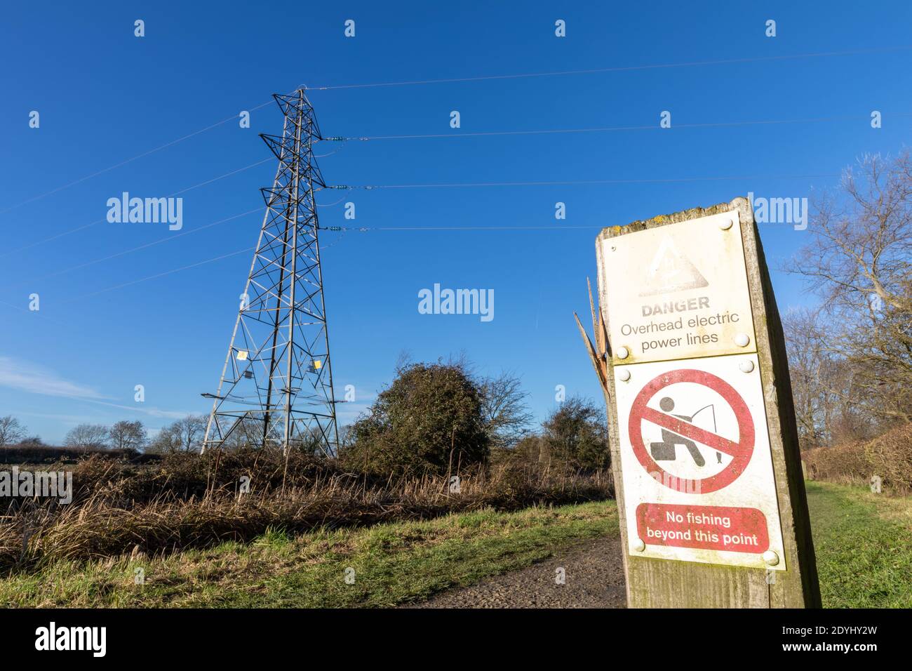 Overhead electric power lines, and danger and no fishing sinage near Kinoulton Swing (BR29), Grantham Canal, Kinoulton, Nottinghamshire Stock Photo