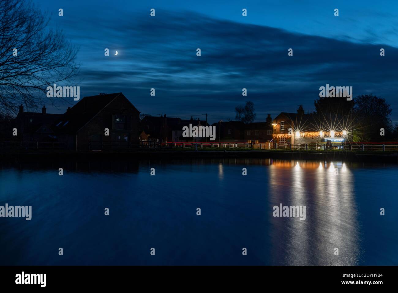 Hickling Basin with Old Wharf & Warehouse and local pub the Plough Inn, at evening twilight, Hickling, Nottinghamshire, England, United Kingdom Stock Photo