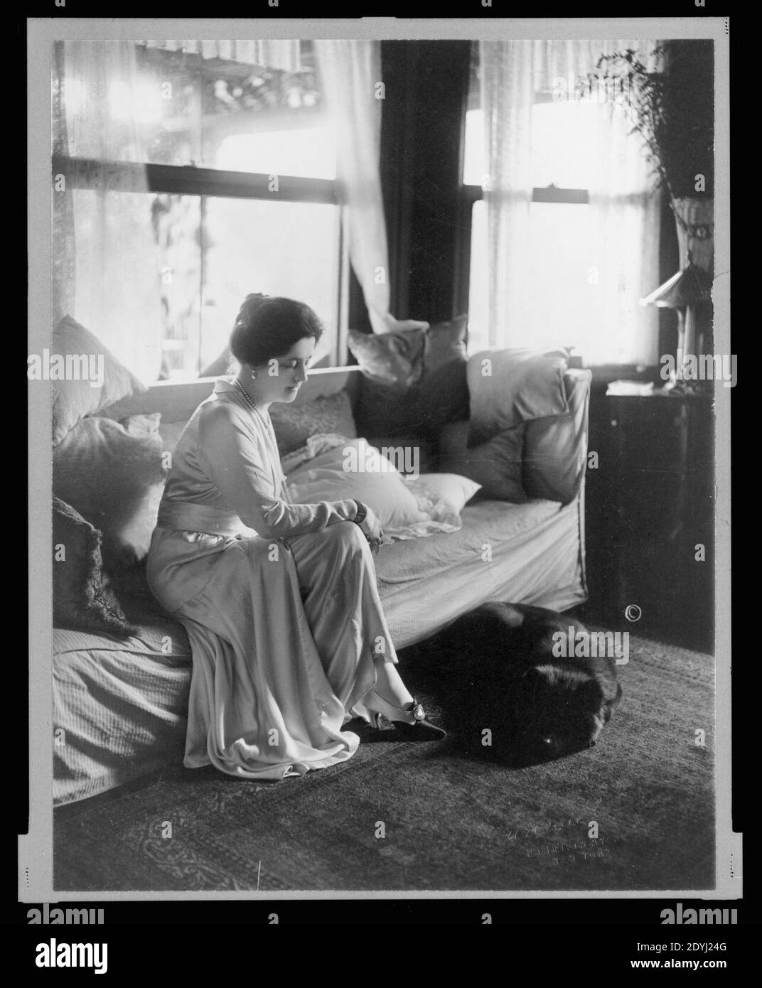 Lady Lucy Duff-Gordon, full-length portrait, seated, facing right, with a dog at her feet) - Marceau Stock Photo