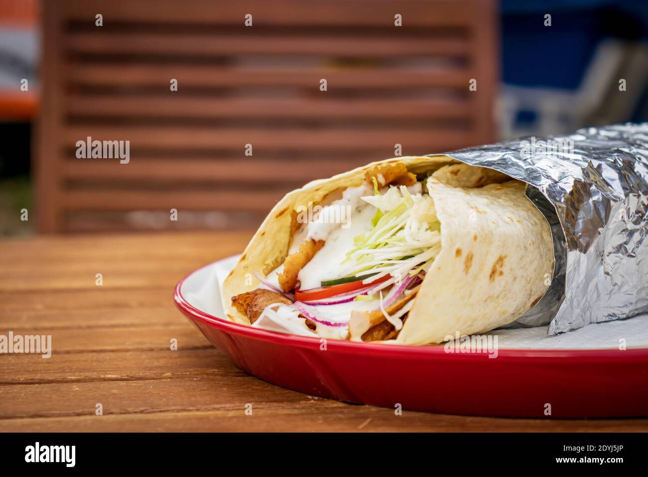Durum Kebab in a local pizza and gyros restaurant Stock Photo