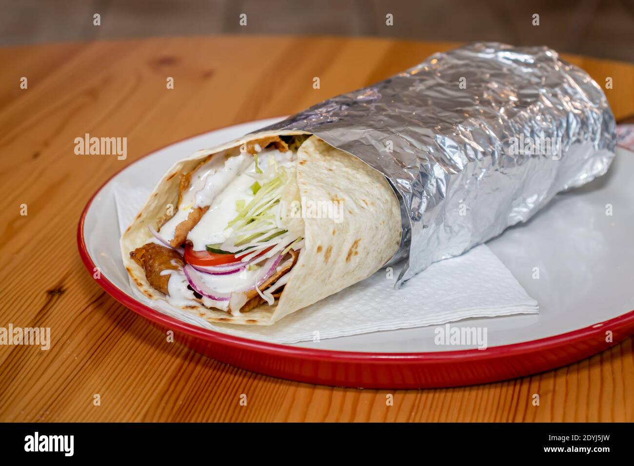 wave Fifty Elucidation Durum Kebab in a local pizza and gyros restaurant Stock Photo - Alamy