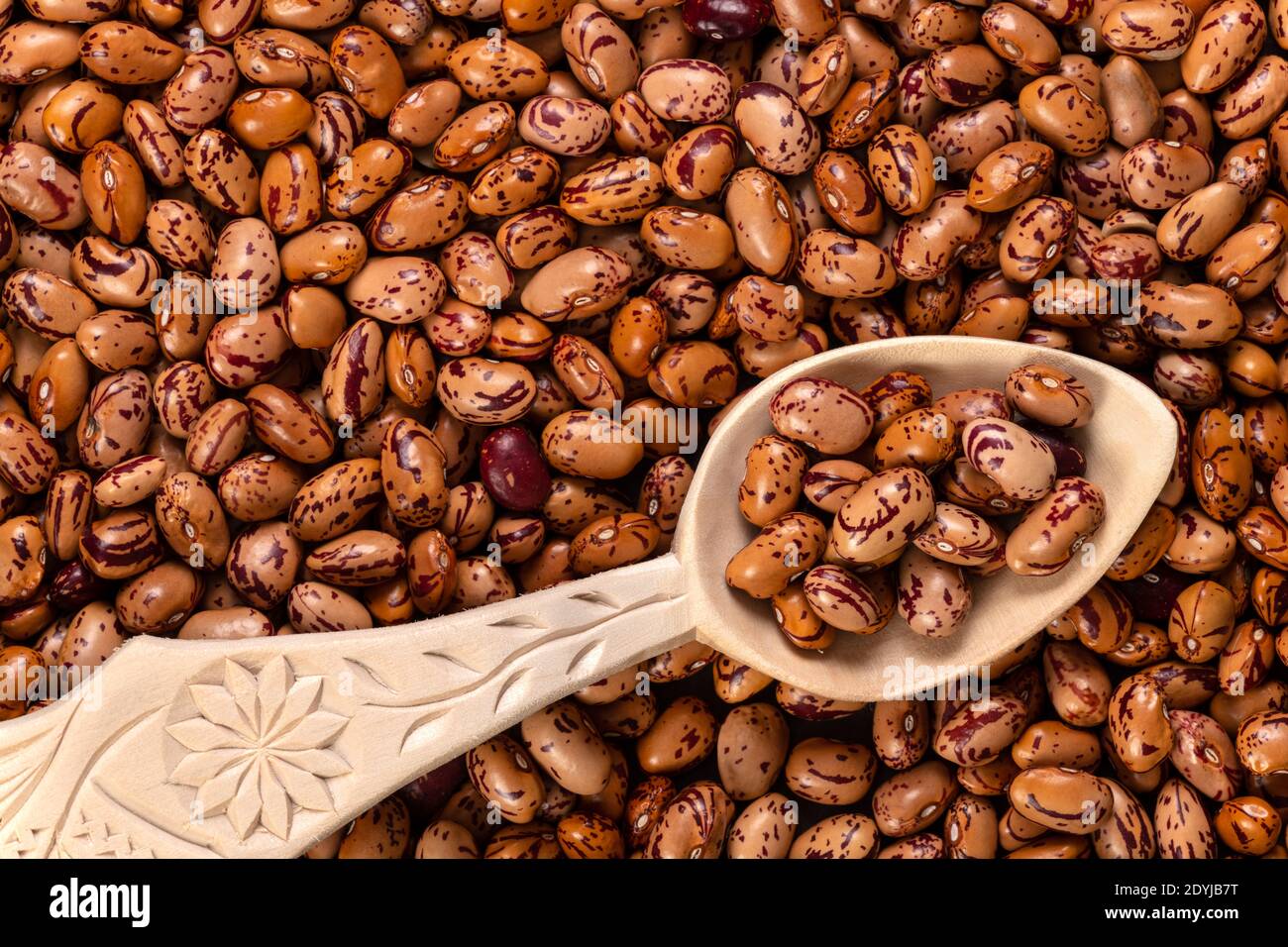 White Cargamanto beans, also known as Cranberry, Borlotti or Romano beans  background and texture. Top view. Stock Photo