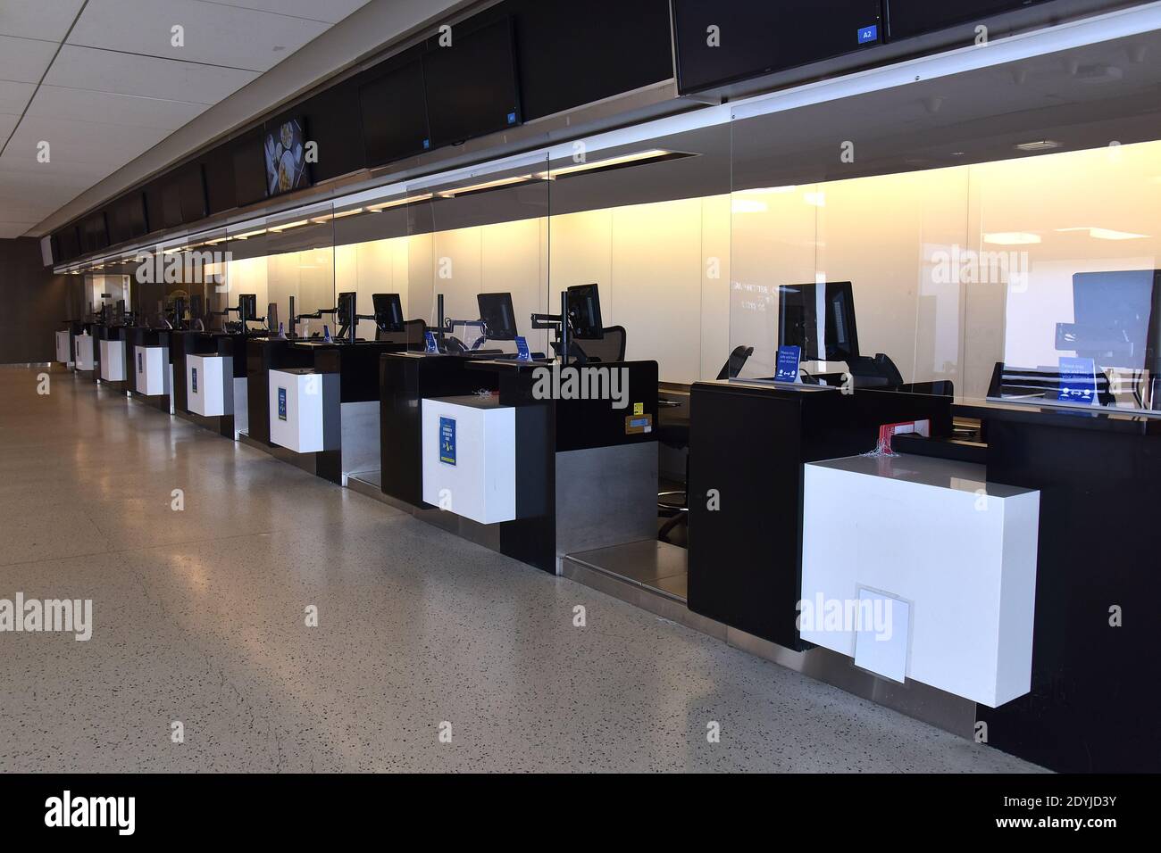 Inside view of an empty British Airways check-in counter at New York's Kennedy International Airport (JFK) in the Queens borough or New York City, NY, December 26, 2020. New York Governor Andrew Cuomo has requested that passengers arriving into New York's JFK aboard British Airways from London Heathrow (LHR) show proof of a negative COVID-19 test prior to departure; countries around the world have imposed restrictions and bans on travel from United Kingdom as a new strain of COVID-19 has been detected. Although the United States has not banned travelers, Argentina, Belgium, Bulgaria, Brazil, Stock Photo