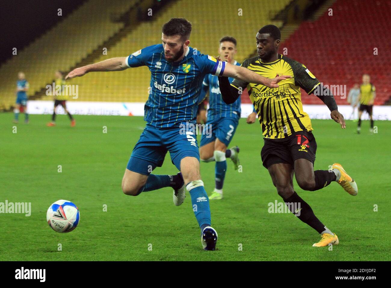 Watford, UK. 26th Dec, 2020. Grant Hanley of Norwich City (L) in action with Ken Sema of Watford (R). EFL Skybet Championship match, Watford v Norwich City at the Vicarage Road Stadium in Watford on Boxing Day, Saturday 26th December 2020. this image may only be used for Editorial purposes. Editorial use only, license required for commercial use. No use in betting, games or a single club/league/player publications. pic by Steffan Bowen/Andrew Orchard sports photography/Alamy Live news Credit: Andrew Orchard sports photography/Alamy Live News Stock Photo