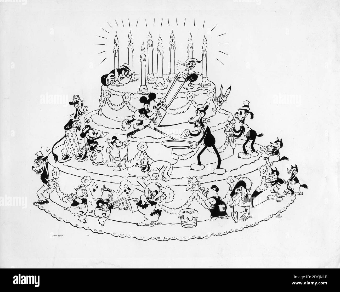 WALT DISNEY's MICKEY MOUSE celebrates his 8th Birthday in 1936 on giant cake with other Disney Characters including DONALD DUCK MINNIE MOUSE GOOFY THREE LITTLE PIGS and the BIG BAD WOLF publicity for Walt Disney Productions / United Artists Stock Photo