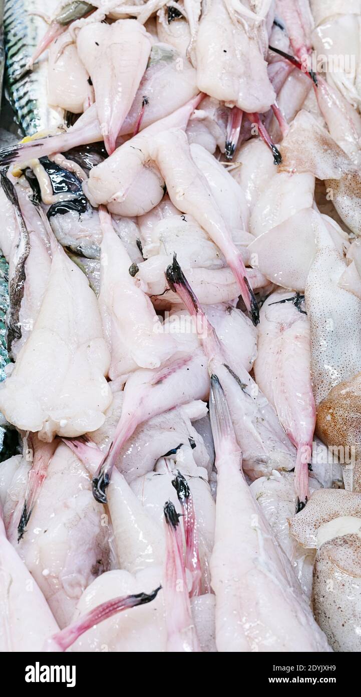 Pile of raw monkfish tails in a fishmonger's shop Stock Photo