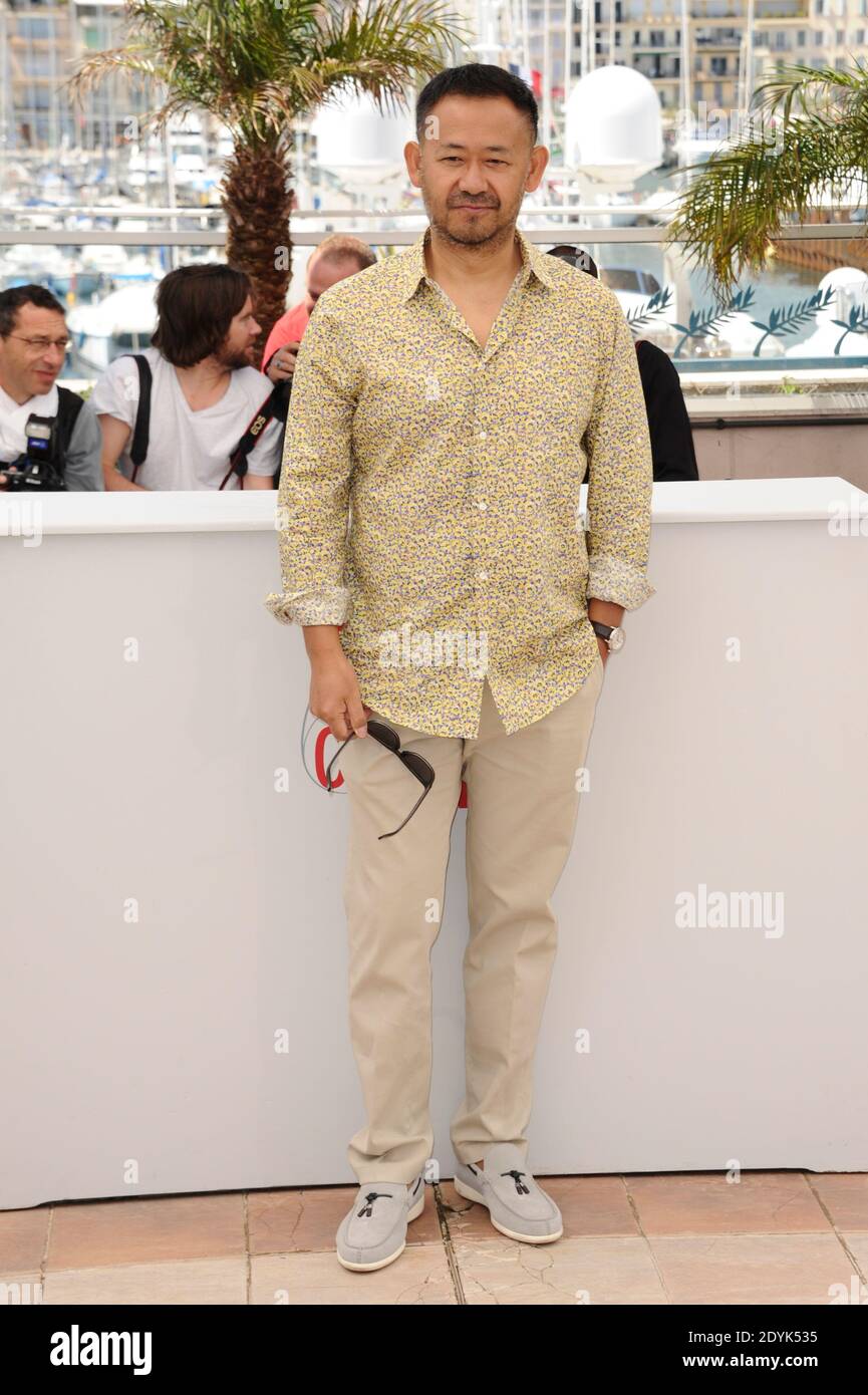 Jiang Wu posing at the 'Tian Zhu Ding' ('A Touch of Sin') photocall ...