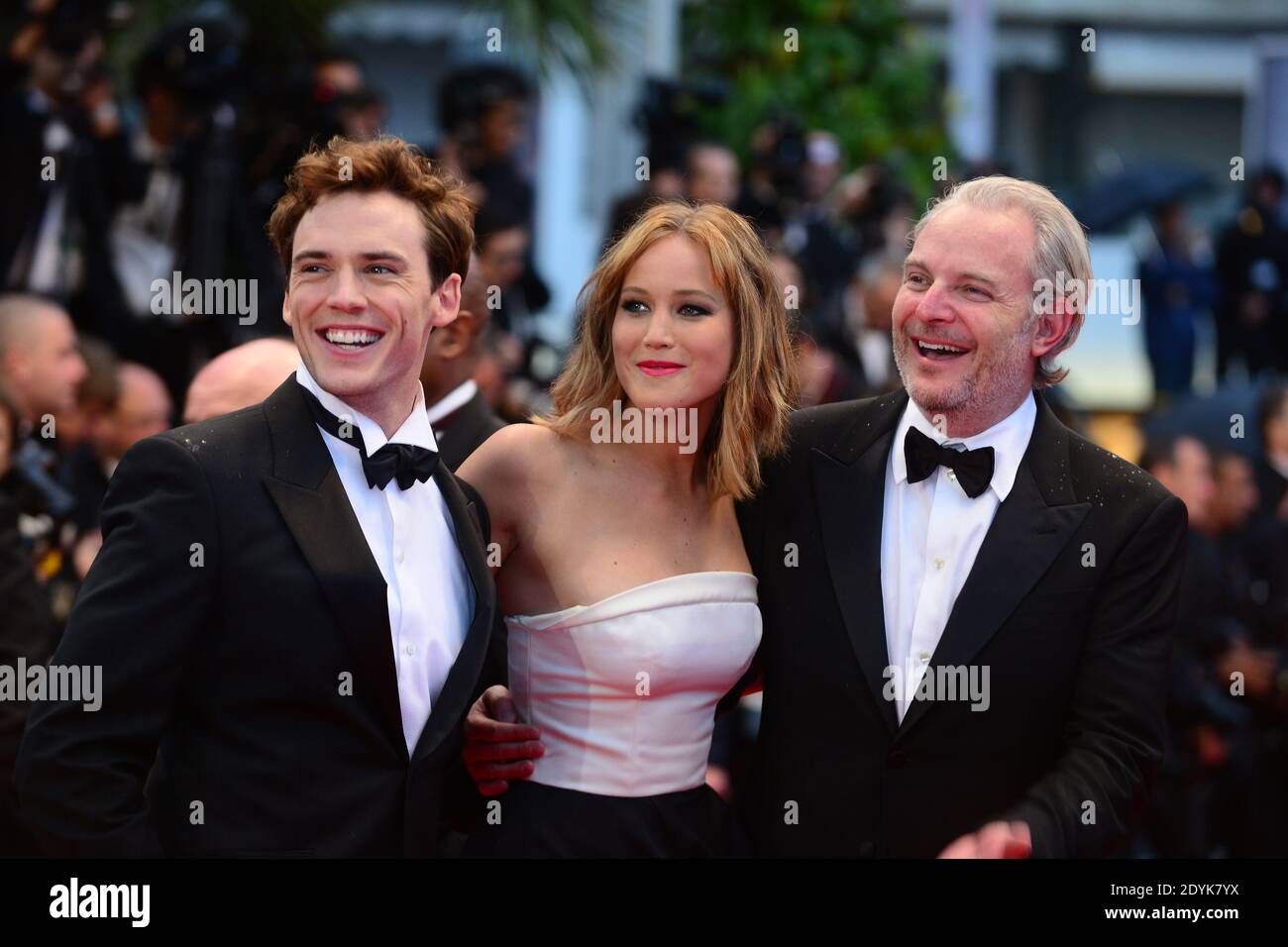 L-R : Sam Cliflin, Jennifer Lawrence, Francis Lawrence arrive for the