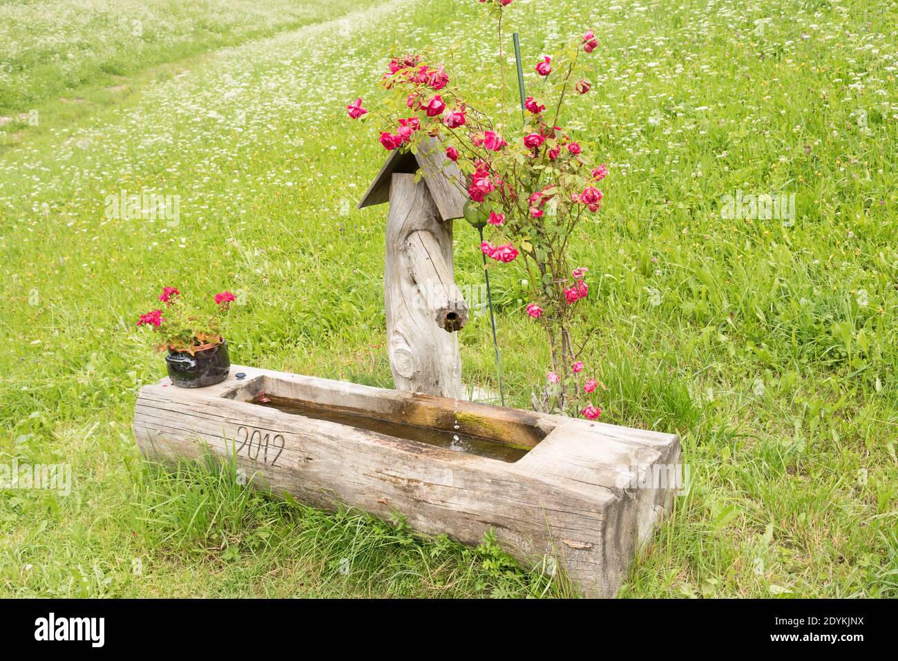 Traditional Water Fountain in The Dolomites Stock Photo