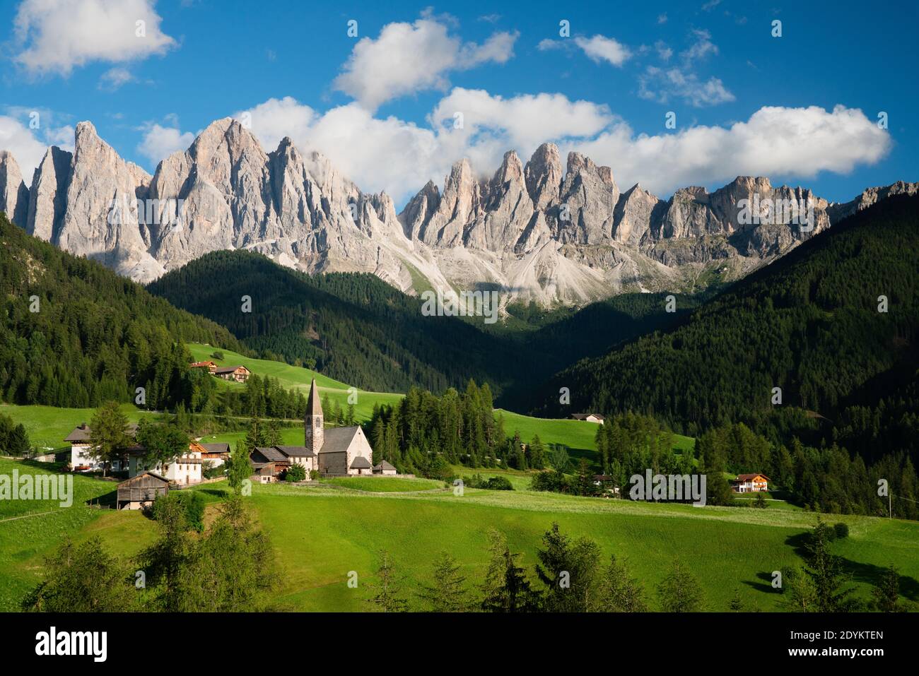 The Odle Mountain Peaks and the Church of Santa Maddalena Stock Photo