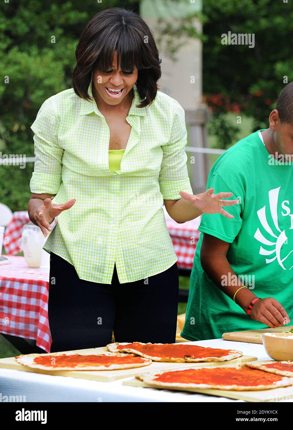 First lady Michelle Obama harvests vegetable from the White House Kitchen Garden's summer crop with children from two New Jersey communities that were affected by Hurricane Sandy and all the children who helped plant the garden in April, at the White House in Washington, DC, USA on May 28, 2013. The first lady was joined by students from Somerville, Massachusettes, Knox County, Tennessee, Milton, Vermont, Washington, DC and Union Beach and Ship Bottom, New Jersey. Photo by Olivier Douliery/ABACAPRESS.COM Stock Photo