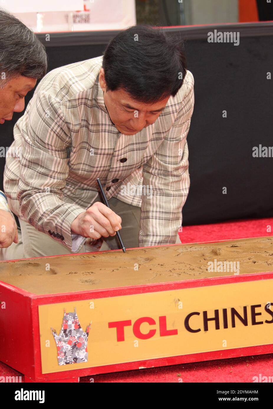 Jackie Chan attends his handprint and footprint ceremony at the TCL
