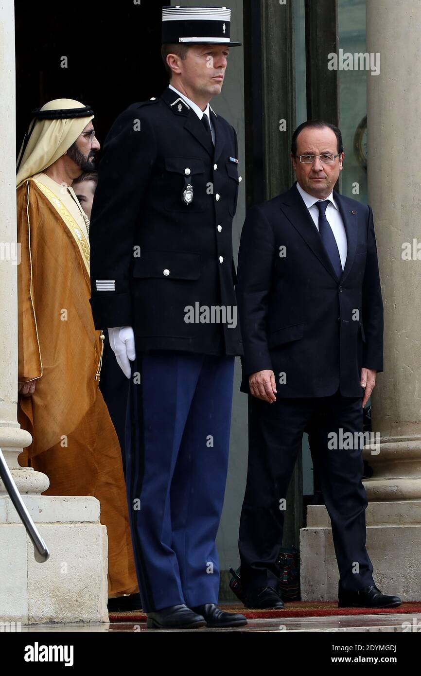 French President Francois Hollande accompanies Dubai ruler Sheikh Mohammed bin Rashid al-Maktoum after a meeting at the Elysee Palace, in Paris, France on June 13, 2013. Photo by Stephane Lemouton/ABACAPRESS.COM Stock Photo