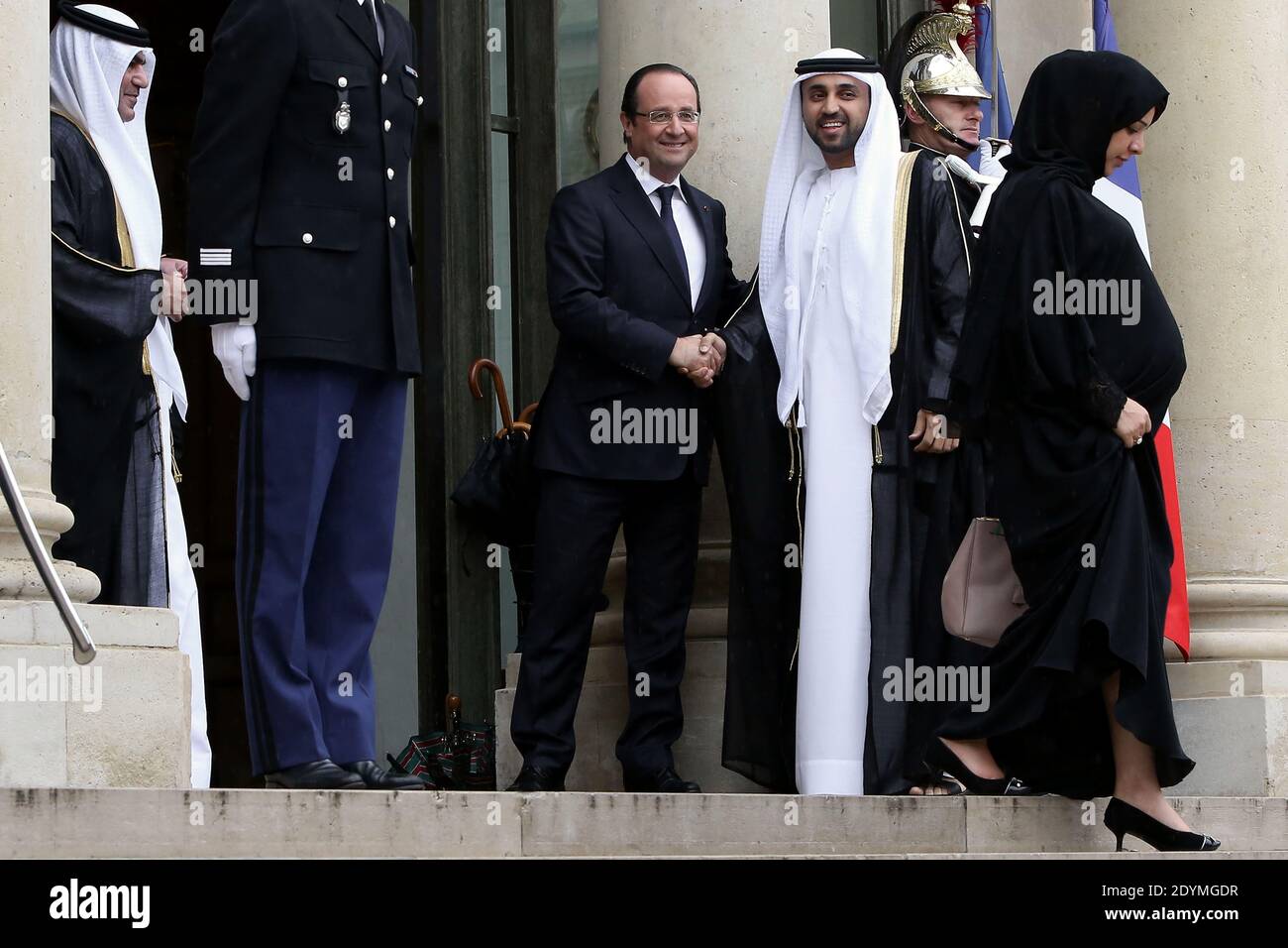 French President Francois Hollande shakes hands with the delegation of Dubai ruler Sheikh Mohammed bin Rashid al-Maktoum after a meeting at the Elysee Palace, in Paris, France on June 13, 2013. Photo by Stephane Lemouton/ABACAPRESS.COM Stock Photo