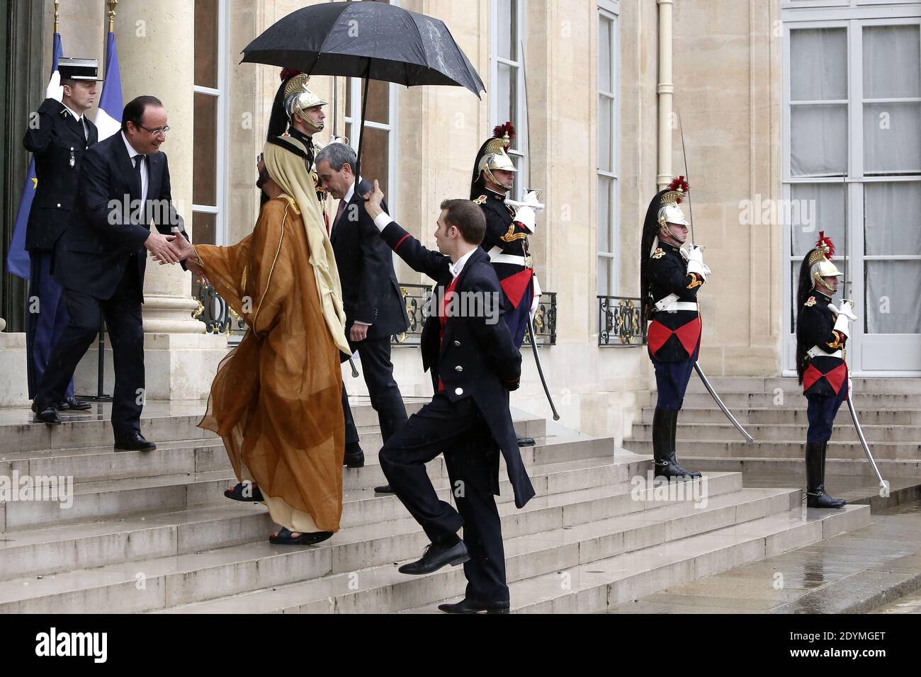 French President Francois Hollande shakes hands with Dubai ruler Sheikh Mohammed bin Rashid al-Maktoum prior to their meeting at the Elysee Palace, in Paris, France on June 13, 2013. Photo by Stephane Lemouton/ABACAPRESS.COM Stock Photo