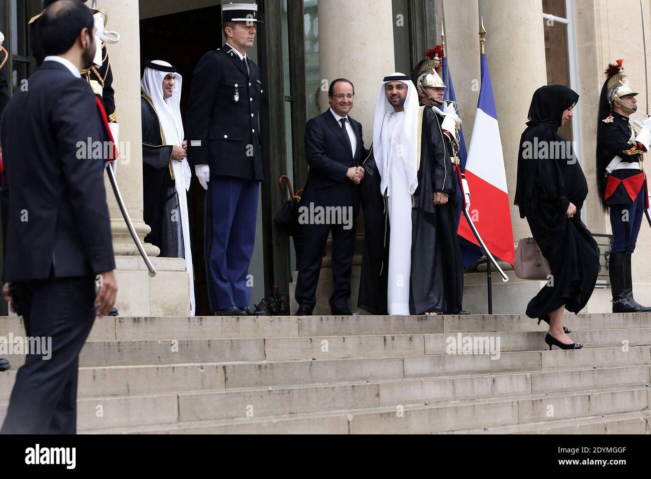 French President Francois Hollande shakes hands with the delegation of Dubai ruler Sheikh Mohammed bin Rashid al-Maktoum after a meeting at the Elysee Palace, in Paris, France on June 13, 2013. Photo by Stephane Lemouton/ABACAPRESS.COM Stock Photo