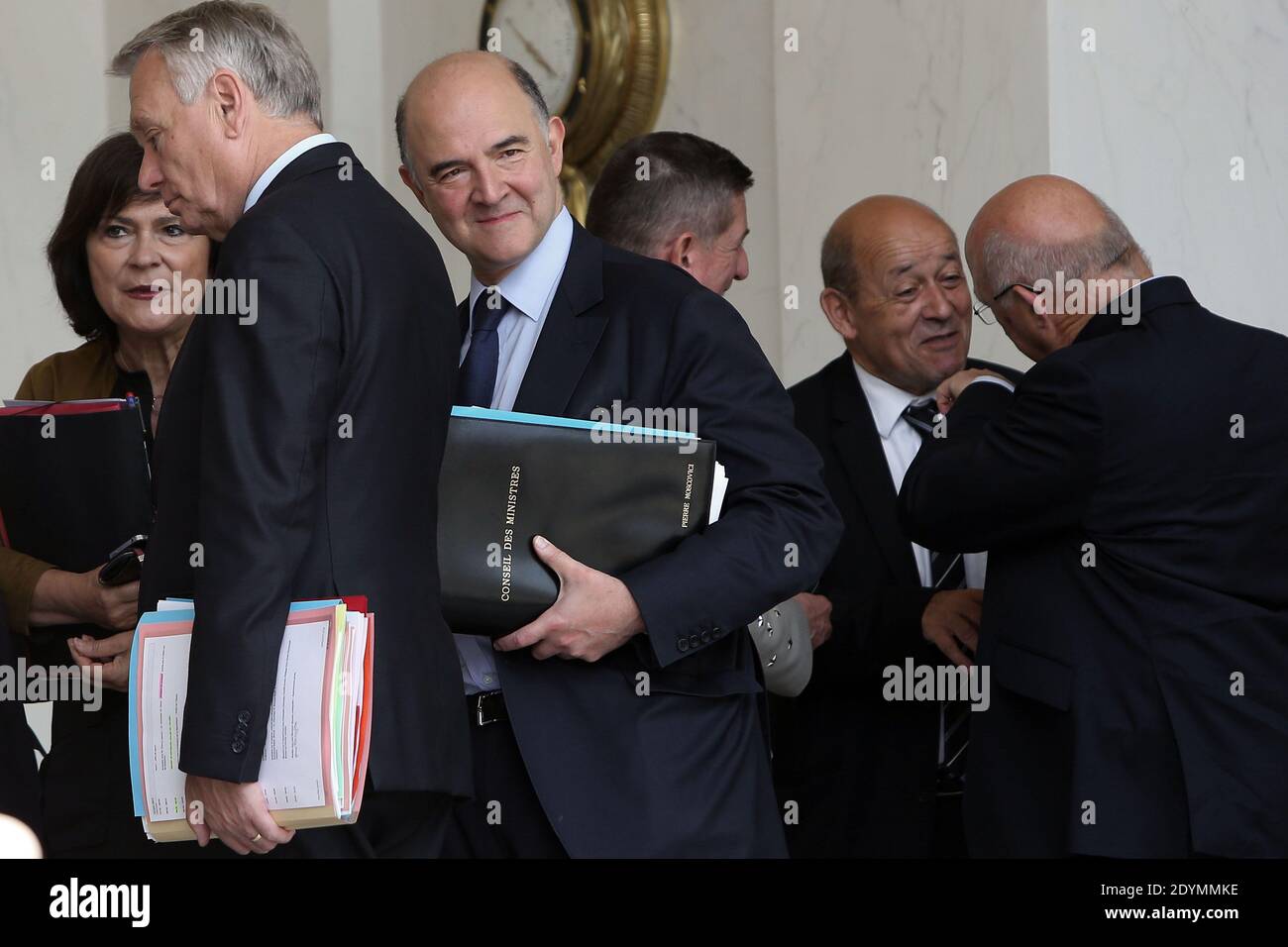 French Junior Minister for Disabled People Marie-Arlette Carlotti, French Prime minister, Jean-Marc Ayrault, French Finance Minister Pierre Moscovici, French Defence Minister Jean-Yves Le Drian and Labour, Employment and Social Dialogue Minister Michel Sapin leave the Elysee presidential Palace after the weekly cabinet meeting, in Paris, France, on June 19, 2013. Photo by Stephane Lemouton/ABACAPRESS.COM Stock Photo