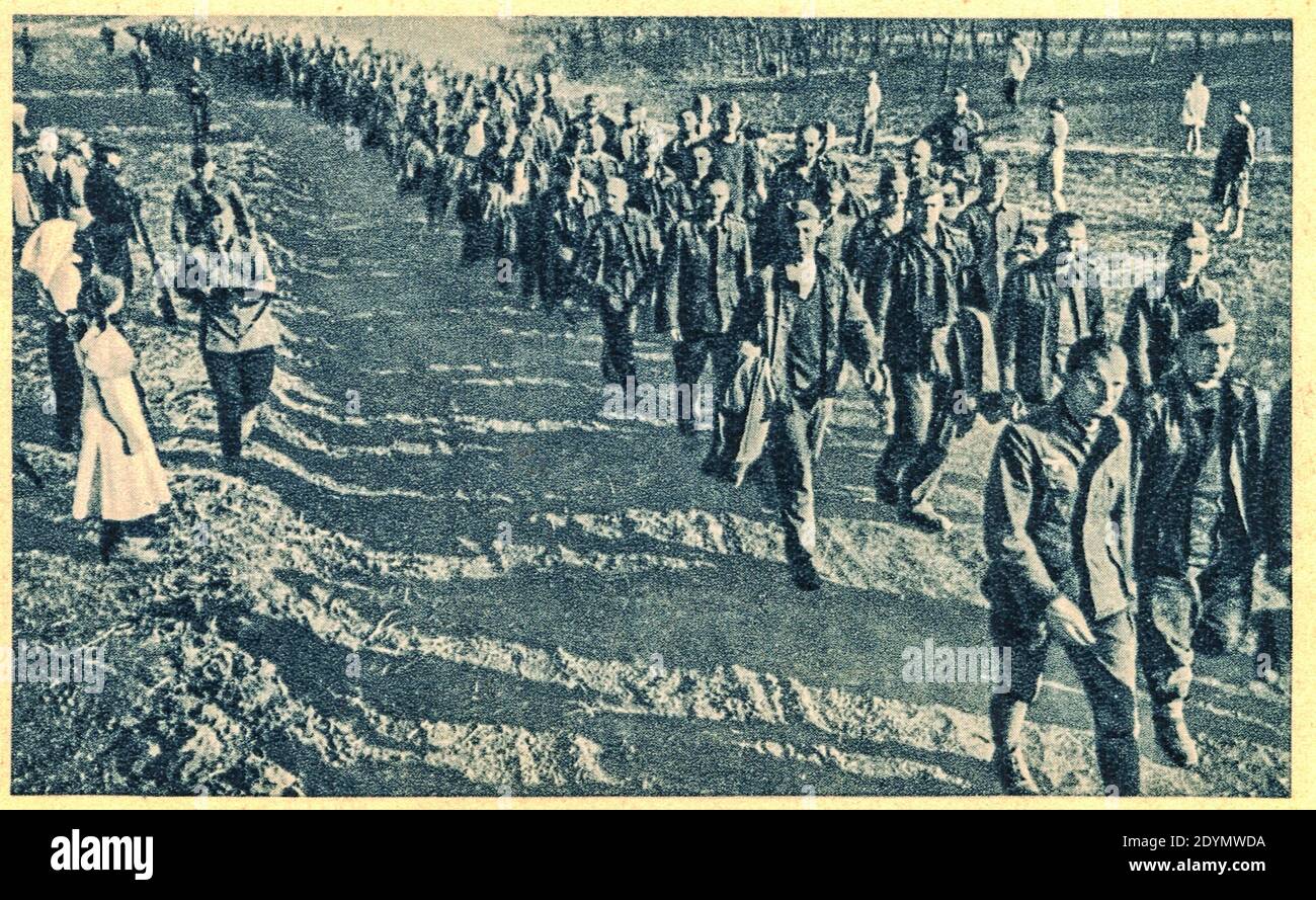 SOVIET UNION - 1944: German war prisoners go somewhere in inner Russia.Archive black and white photo. Stock Photo