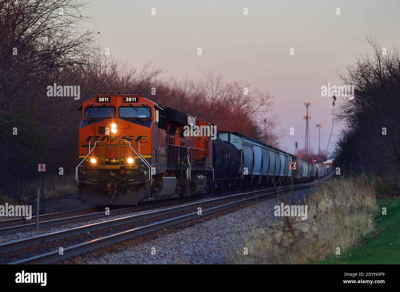 Bartlett, Illinois, USA. Two Burlington Northern Santa Fe locomotives head up a Canadian Pacific Railway freight train westbound through Bartlett. Stock Photo