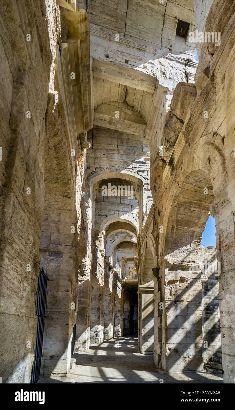 interior view of the arcades of Arènes d'Arles, the Roman amphitheatre in the city of Arles, Bouches-du-Rhône department, Southern France Stock Photo