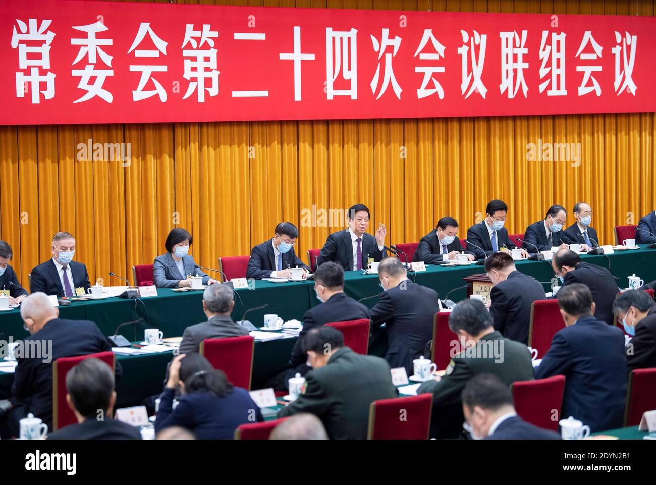 Beijing, China. 26th Dec, 2020. Li Zhanshu, chairman of the National People's Congress (NPC) Standing Committee, delivers a speech while attending a joint inquiry into a report on the rectifications of the problems found in the execution of the 2019 central budget and other fiscal matters held by the 24th session of the 13th NPC Standing Committee in Beijing, capital of China, Dec. 26, 2020. Credit: Li Tao/Xinhua/Alamy Live News Stock Photo