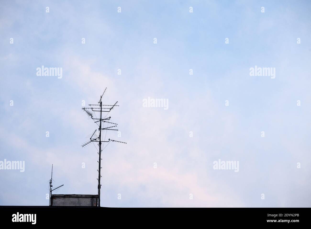 Television antennas, VHF and UHF frequencies, at the top of a European