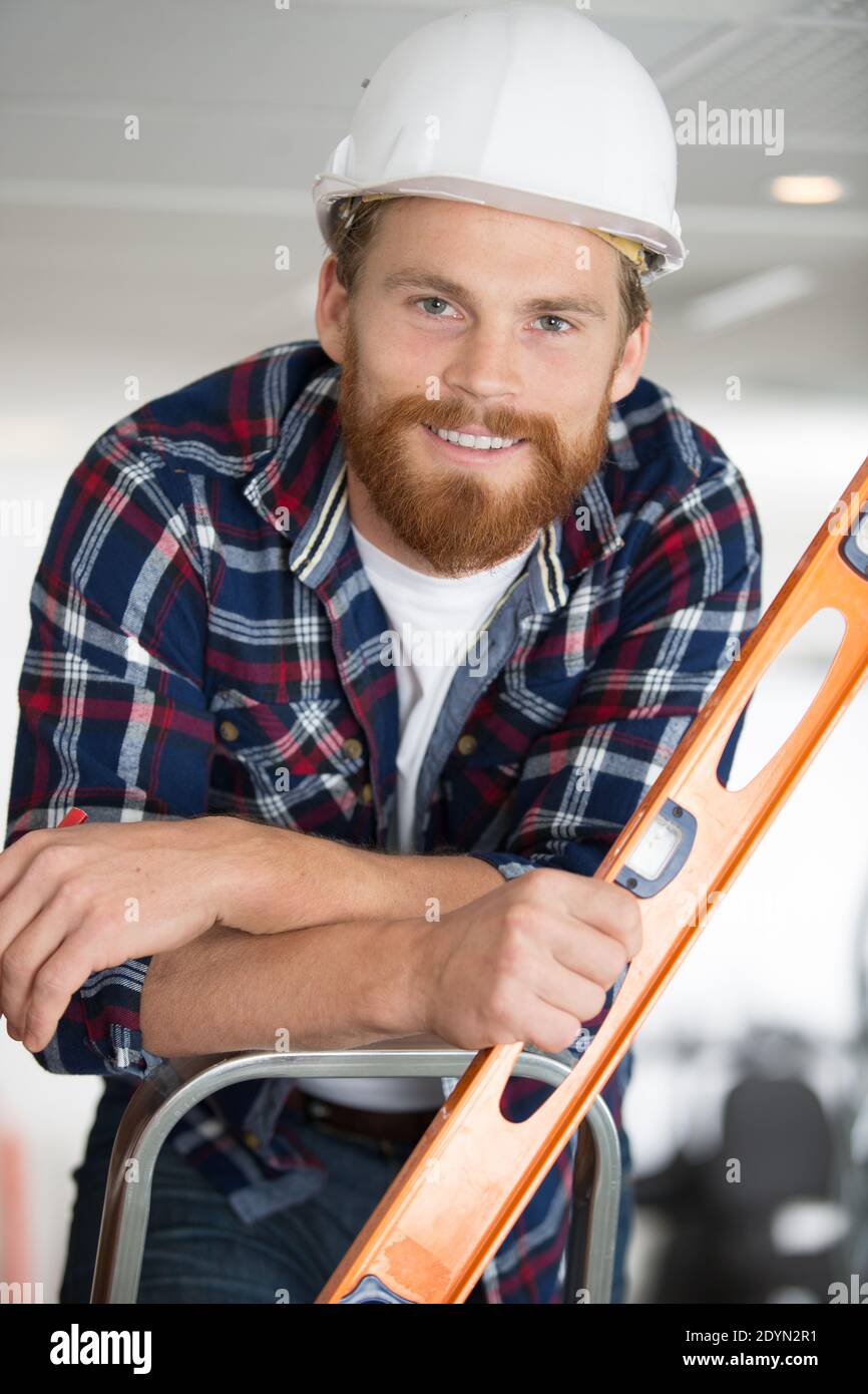 Construction man ladder level hi-res stock photography and images - Alamy