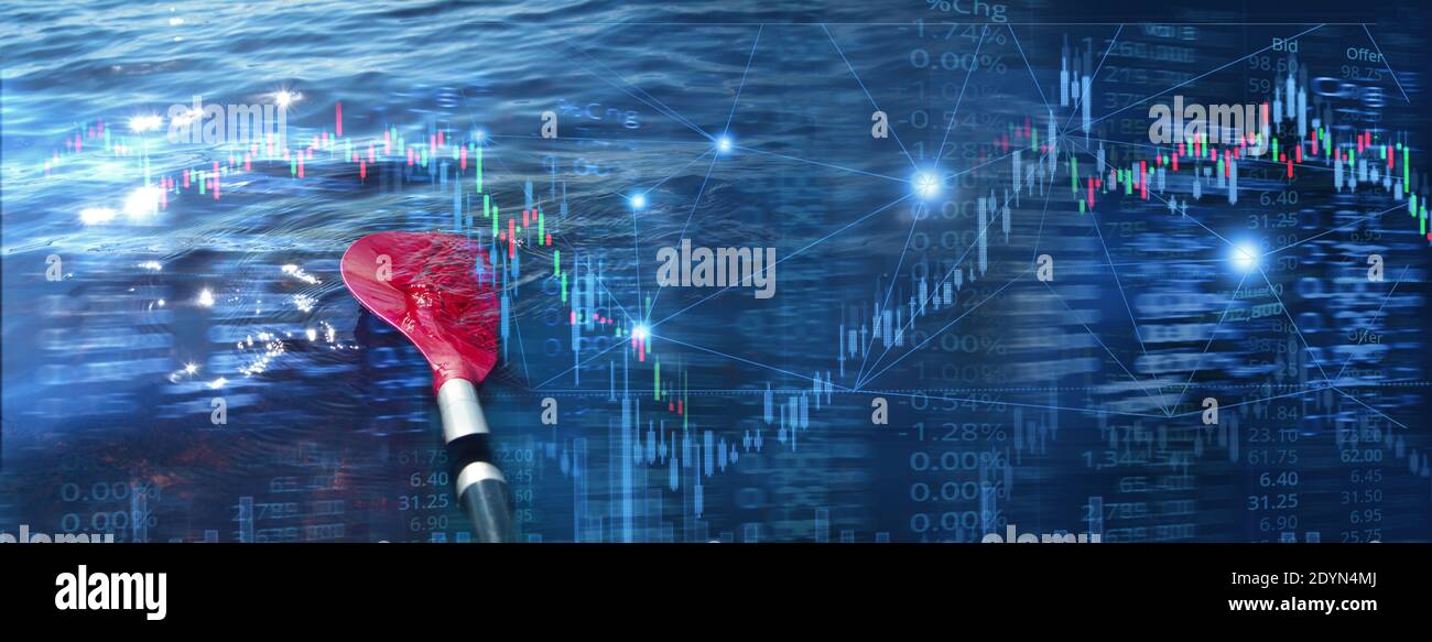 red rowing paddle in dark blue water with stock market business trading garph and index information in consistency concept banner background Stock Photo