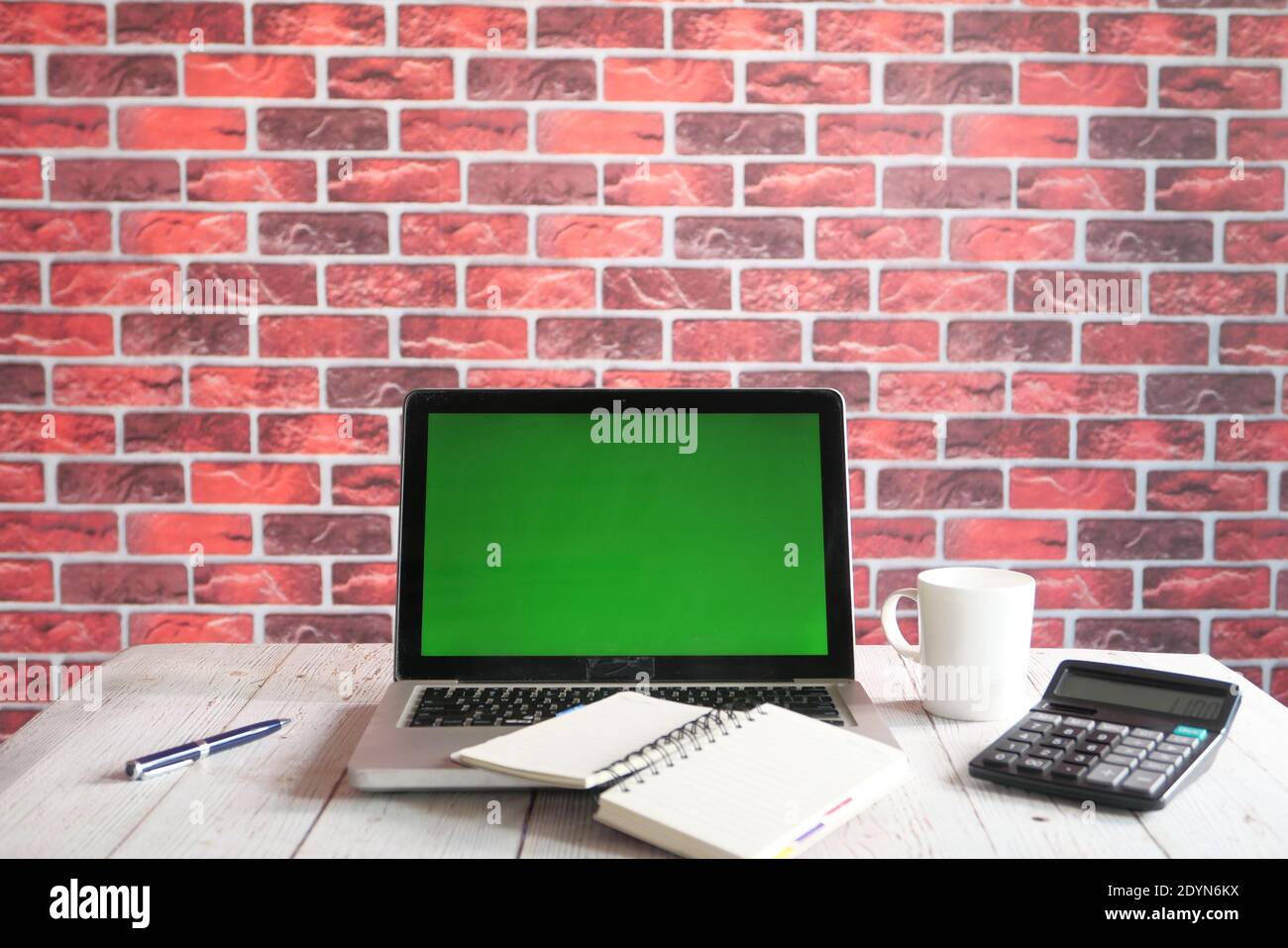 laptop with blank screen on office desk. Stock Photo