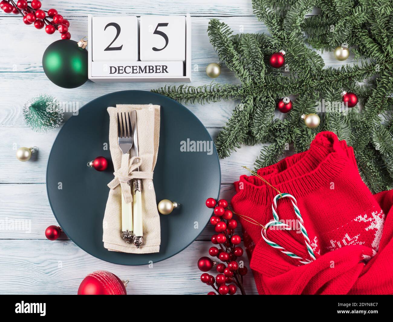 Christmas dinner table plate setting with decor Stock Photo Alamy